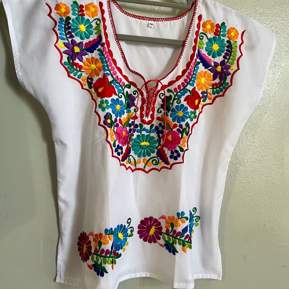 New embroidered blouse. Made in Mexico. Size small. Beautiful colors.